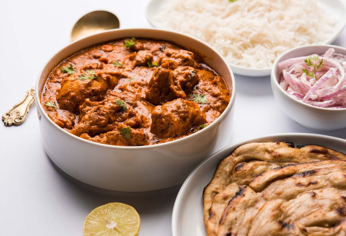Chicken tikka served with spices and herbs, featured in a blog about finding the best nearby options.