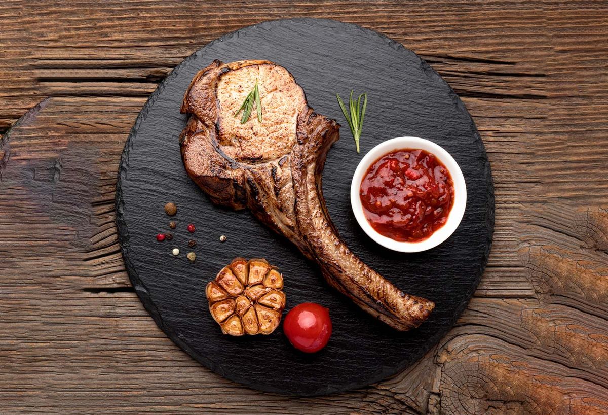 Tandoori-style rack of lamb grilled with spices, highlighted as a signature Indian dish.
