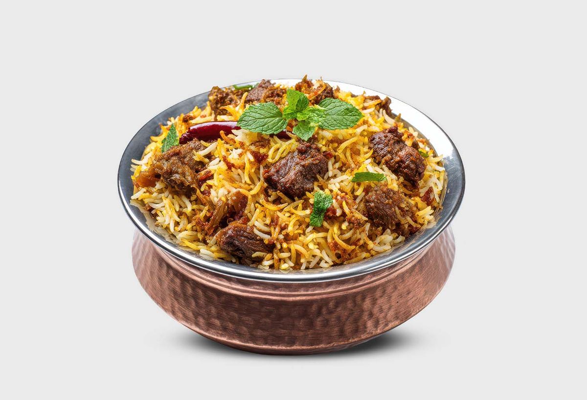 Biryani rice and curry dishes paired together, highlighting perfect Indian meal combinations.