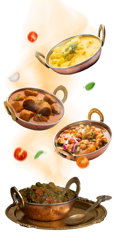 Top view of Indian food dishes with spices and ingredients arranged neatly, highlighting a mix of vegetarian and traditional cuisine.